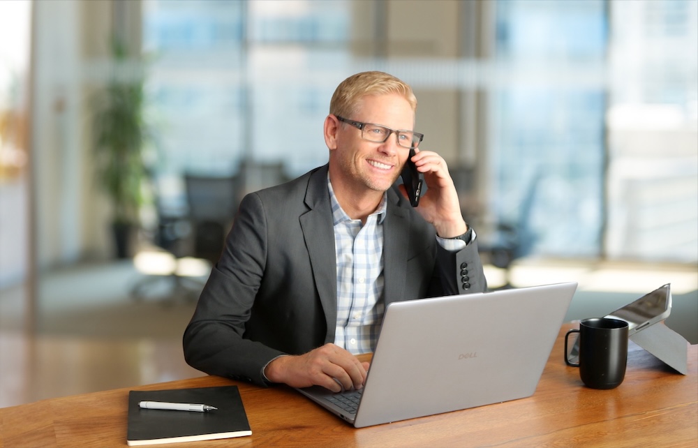 John Bradbury on the phone with a client